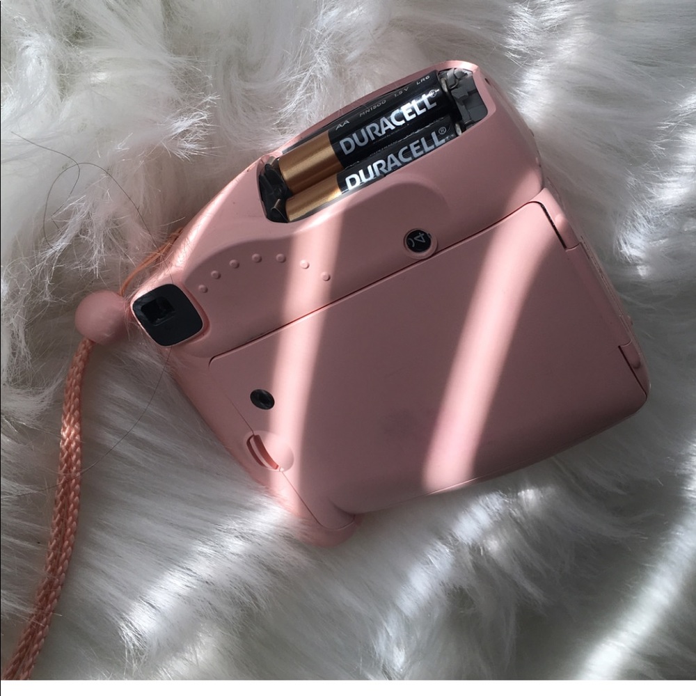 light pink polaroid camera